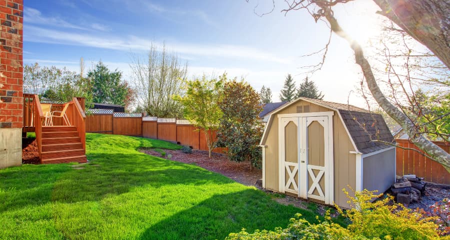 Fenced backyard with storage shed in Little Rock